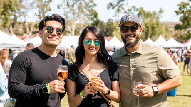 Crowd enjoying craft beer, wine, and gourmet food at the Angels Wine, Food & Brew Festival in Ventura County.
