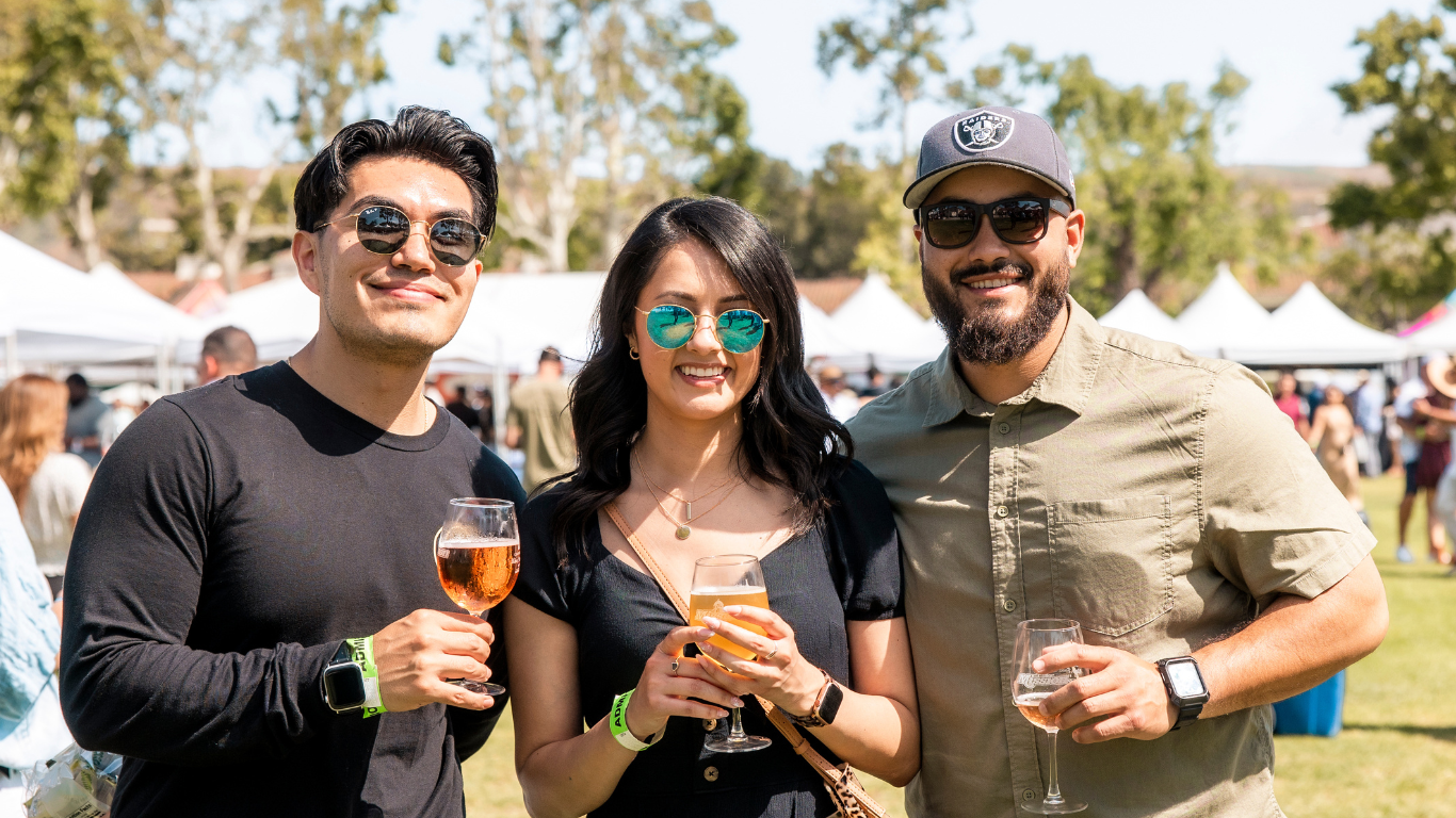 Crowd enjoying craft beer, wine, and gourmet food at the Angels Wine, Food & Brew Festival in Ventura County.
